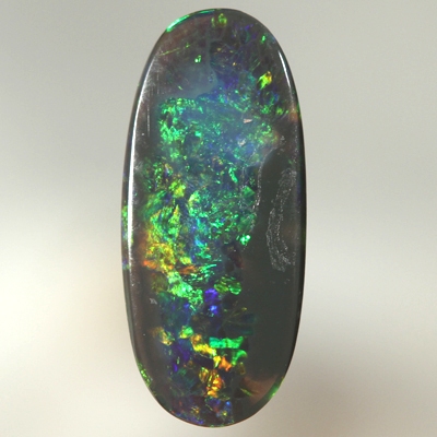 SOLID BLACK OPAL Bright sparkles of orange and green with a touch blue